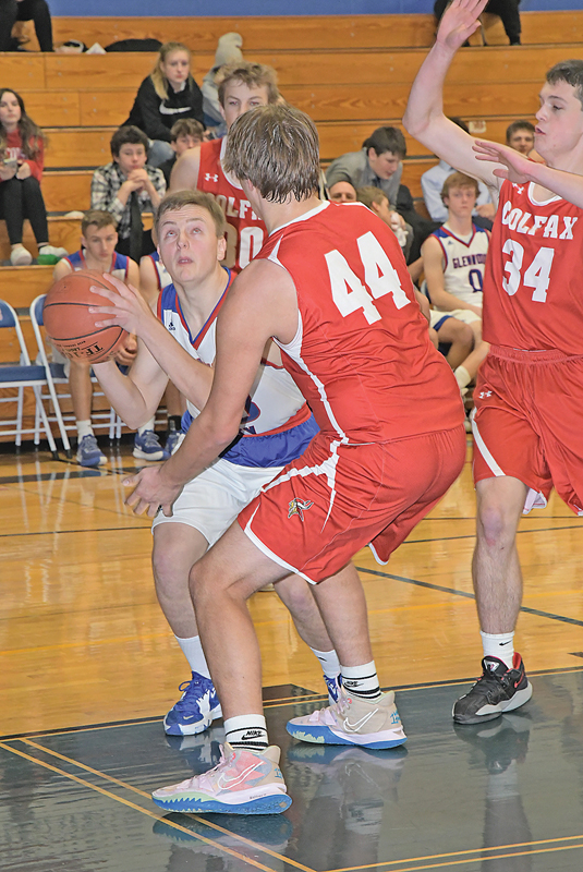 GLENWOOD CITY senior Brendan Booth (#33) looked to get a shot off during late action in the Toppers home game versus Colfax on December 7. —photo by Shawn DeWitt 