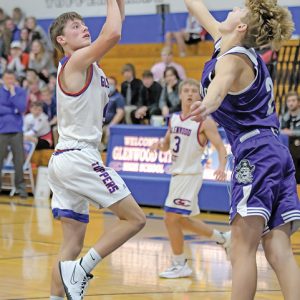 GLENWOOD CITY’S Bryce Wickman looked to put this running jump shot over a Grantsburg defender in the Hilltoppers’ season and home opener November 30. —photo by Jacob Maes Photography
