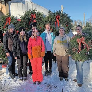 Boyceville FFA members attended a field trip to Conklin’s Tree Farm in Wheeler on December 11th. Owner and Boyceville FFA alumni member, Cathy Bauer, took members on a tour of the different tree plots where they learned the ins and outs of what tree farming entails, as well as how trees at Conklin’s are sustainably grown and harvested. Members also had the opportunity to help assemble and decorate wreaths, help customers, and play with the resident kittens. After the tour at Conklin’s, FFA members toured Sam’s Christmas Village in Somerset. Fun was had by all! Pictured from L to R: Boyceville FFA Advisor Jenna Behrends, Jadynn Traxler, Gabby Nelson, Kaylin Laursen, Olivia Jones, Abby Bauer, and Jamie Lehmann. —photo submitted
