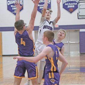 CONTESTED SHOT — Boyceville guard Simon Evenson put up this jump shot from the lane during the Bulldogs’ home basketball game against Clayton January 4. Evenson finished with a team-high nine points as the Bulldogs beat the Bears 41-23. —photo by Shawn DeWitt