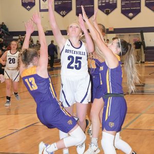 SPLITTING a pair of Clayton defenders, Sarah Stoveren (#25) put up this shot attempt during second-half action in a January 4th home non-conference game. —photo by Shawn DeWitt