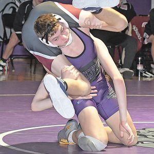 BOYCEVILLE’S Jake Bialzik worked a takedown on his Spring Valley/Elmnwood opponent at 138 pounds in a Dunn-St. Croix dual hosted by the Bulldogs January 6. Bialzik scored a pin at 1:36 to help Boyceville win the dual 42-34. —photo by Shawn DeWitt